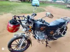 SDA church members gift pastor a motorcycle to boost rural outreach